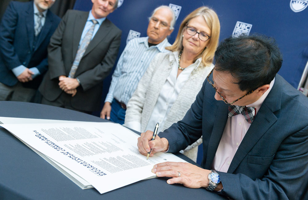UBC President Santa Ono signs the Declaration of Truth and Reconciliation Commitments