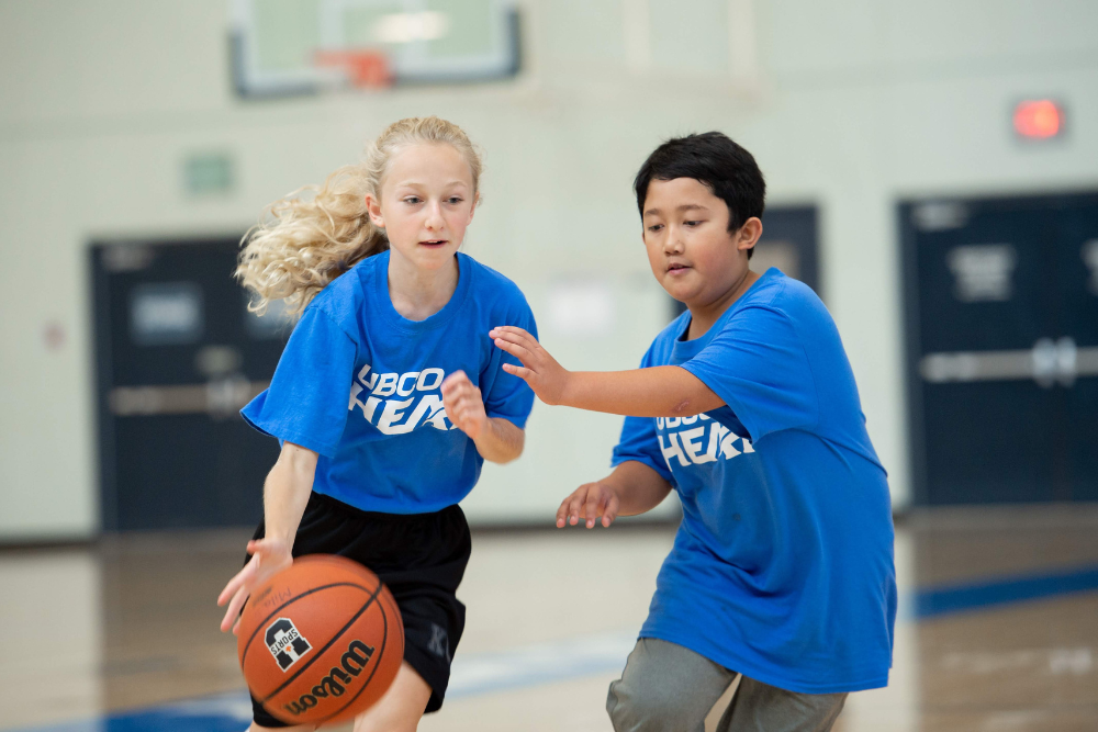 Two children engaging in UBCO Heat Sport camp