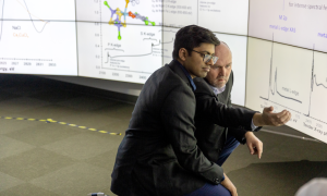 Bhavesh Gnnanapareddy and Dr. Robert Szilagyi analyzing the screens at UBCO’s Visualization and Emerging Media Studio.